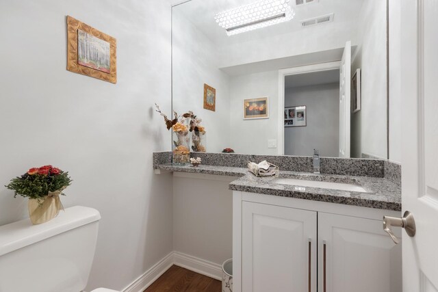 1452 Hemlock Knoll Ter, Northbrook, IL 60062 - half bath with toilet, wood finished floors, vanity, and baseboards