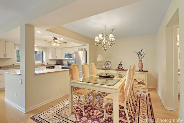 1704 Wildberry Dr Unit F, Glenview, IL 60025 - dining area featuring a chandelier, a ceiling fan, light wood-type flooring, baseboards, and recessed lighting