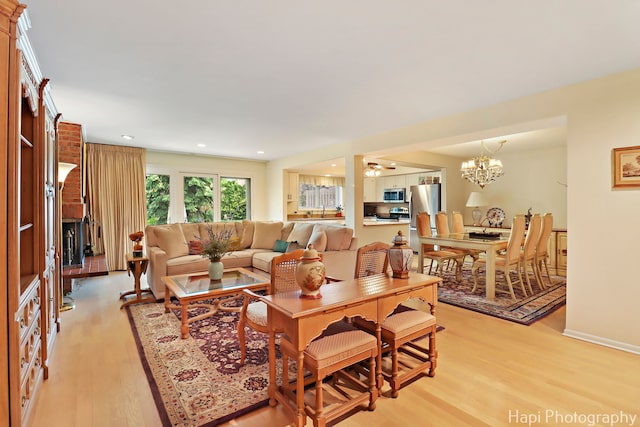 1704 Wildberry Dr Unit F, Glenview, IL 60025 - living area with light wood-style flooring, recessed lighting, a fireplace, a chandelier, and ceiling fan