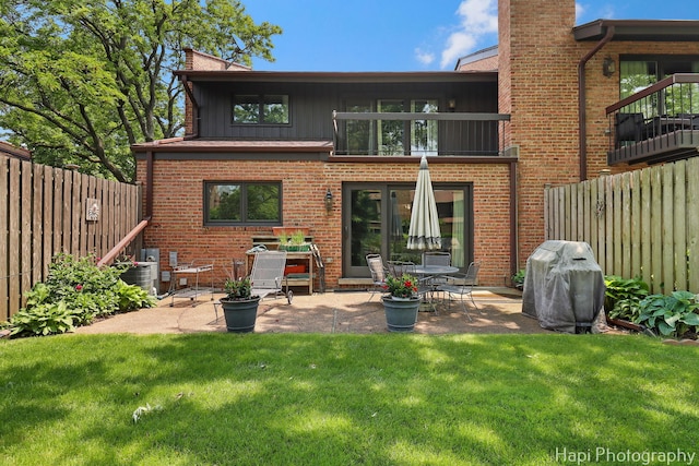 1704 Wildberry Dr Unit F, Glenview, IL 60025 - back of property with a patio, brick siding, a chimney, and central AC