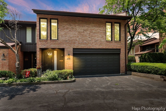 1704 Wildberry Dr Unit F, Glenview, IL 60025 - view of front of property with driveway, an attached garage, and brick siding