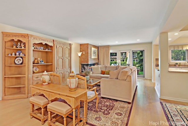 1704 Wildberry Dr Unit F, Glenview, IL 60025 - living room featuring light wood-style flooring, recessed lighting, baseboards, and a fireplace