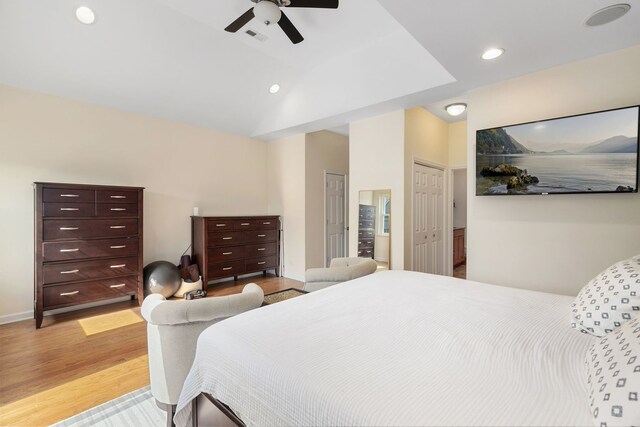 1828 N California Ave, Chicago, IL 60647 - bedroom with light wood-type flooring, ceiling fan, two closets, recessed lighting, and vaulted ceiling