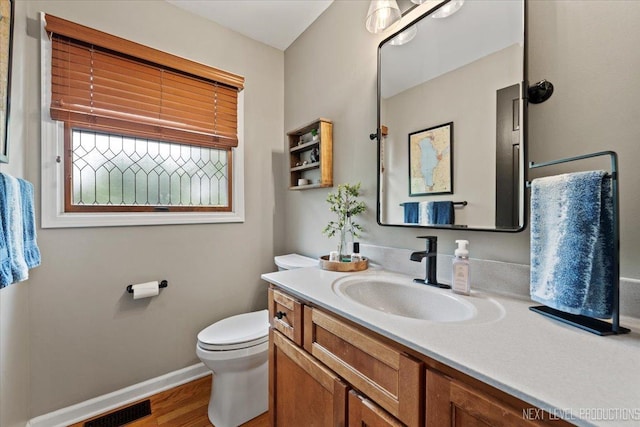 39W841 Prunetree Ln, Saint Charles, IL 60175 - bathroom with vanity, toilet, baseboards, and wood finished floors