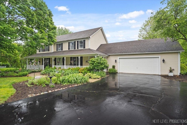 39W841 Prunetree Ln, Saint Charles, IL 60175 - view of front facade with driveway, a porch, a garage, and roof with shingles