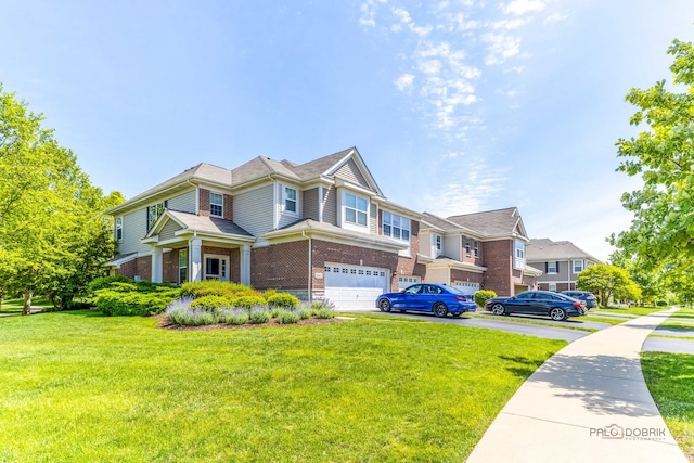 2659 Dunraven Ave, Naperville, IL 60540 - townhome / multi-family property featuring brick siding, asphalt driveway, a garage, and a front yard