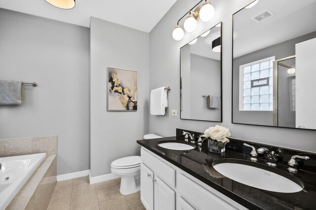 2035 W Crystal St Unit 3, Chicago, IL 60622 - full bath with a jetted tub, double vanity, toilet, baseboards, and tile patterned floors