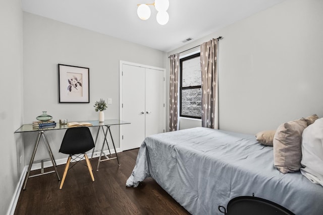 2035 W Crystal St Unit 3, Chicago, IL 60622 - bedroom featuring wood finished floors, an office area, a closet, a chandelier, and baseboards