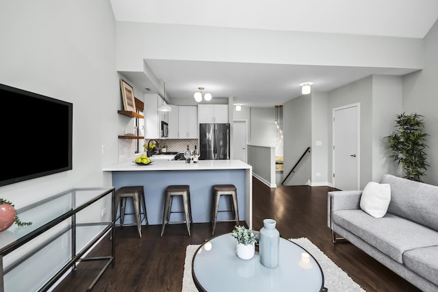 2035 W Crystal St Unit 3, Chicago, IL 60622 - living room with dark wood-style flooring and baseboards
