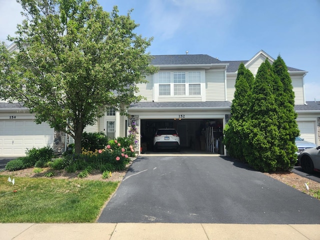 152 W Chatham Ln, Round Lake, IL 60073 - view of front of house featuring asphalt driveway and an attached garage
