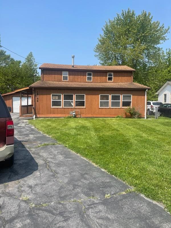 15046 Perry Ave, South Holland, IL 60473 - view of front facade featuring a front yard and a garage