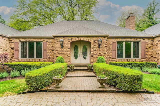 15 Highview Cir, Hawthorn Woods, IL 60047 - view of front facade featuring a chimney, a shingled roof, and brick siding