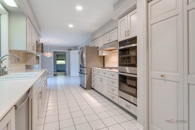 15 Highview Cir, Hawthorn Woods, IL 60047 - kitchen with stainless steel appliances, a sink, light countertops, under cabinet range hood, and light tile patterned floors