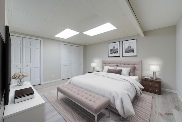 15 Highview Cir, Hawthorn Woods, IL 60047 - bedroom with multiple closets, baseboards, and light wood finished floors