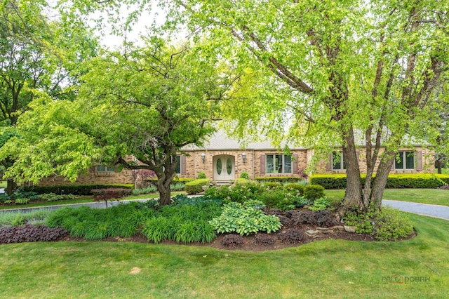 15 Highview Cir, Hawthorn Woods, IL 60047 - view of front of property featuring a front lawn, brick siding, and french doors