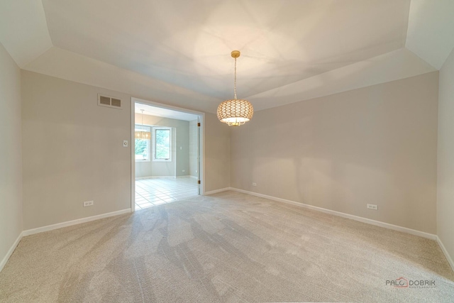 15 Highview Cir, Hawthorn Woods, IL 60047 - spare room with light colored carpet, baseboards, a tray ceiling, and a chandelier