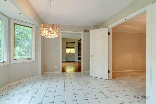15 Highview Cir, Hawthorn Woods, IL 60047 - unfurnished dining area featuring a chandelier, baseboards, and light tile patterned flooring