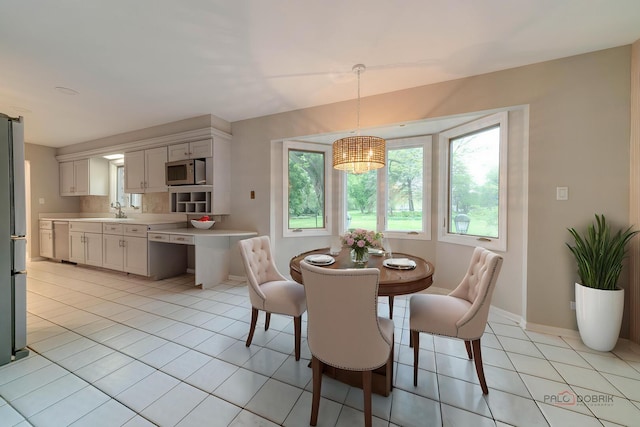 15 Highview Cir, Hawthorn Woods, IL 60047 - dining space featuring light tile patterned floors, baseboards, and a chandelier