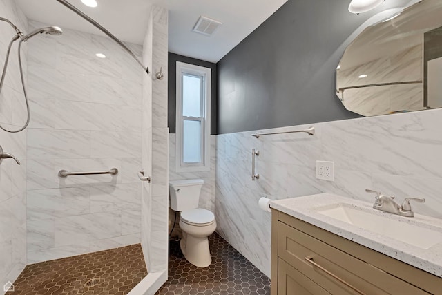 4042 N Kenneth Ave, Chicago, IL 60641 - full bathroom with tile walls, a shower stall, vanity, a wainscoted wall, and tile patterned flooring