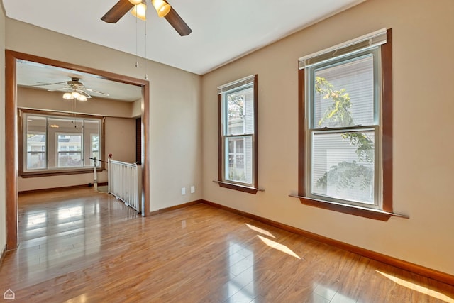 4042 N Kenneth Ave, Chicago, IL 60641 - spare room with ceiling fan, plenty of natural light, and light wood-style floors