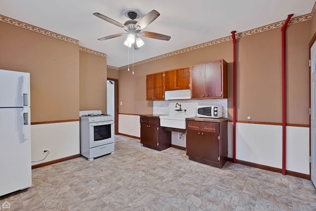 4042 N Kenneth Ave, Chicago, IL 60641 - kitchen featuring white appliances, a ceiling fan, and light countertops