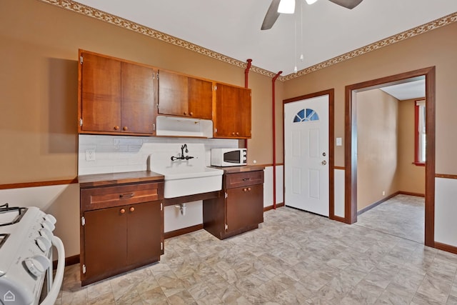 4042 N Kenneth Ave, Chicago, IL 60641 - kitchen with white appliances, ceiling fan, decorative backsplash, brown cabinets, and light countertops