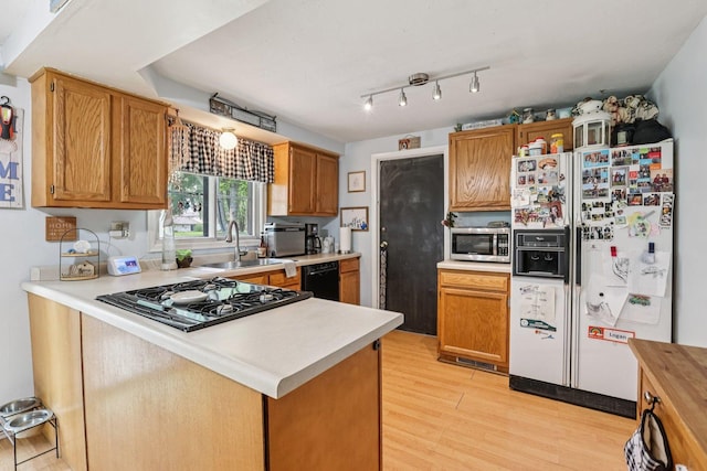 917 Aimtree Pl, Schaumburg, IL 60194 - kitchen with white refrigerator with ice dispenser, stainless steel microwave, black dishwasher, stovetop, and a sink