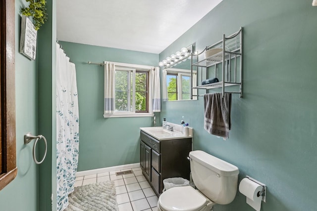 917 Aimtree Pl, Schaumburg, IL 60194 - bathroom with toilet, vanity, tile patterned floors, curtained shower, and baseboards