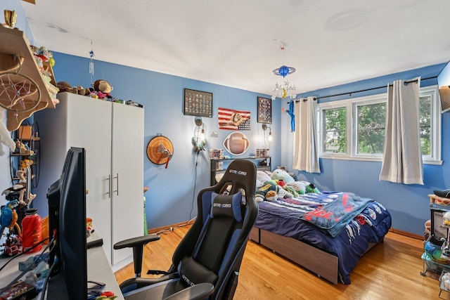 917 Aimtree Pl, Schaumburg, IL 60194 - bedroom with wood finished floors and a chandelier