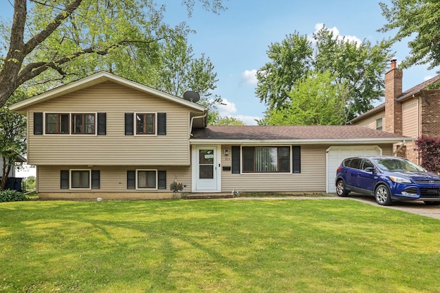 917 Aimtree Pl, Schaumburg, IL 60194 - split level home with an attached garage, a front yard, and concrete driveway