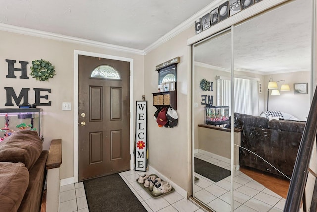 917 Aimtree Pl, Schaumburg, IL 60194 - entryway featuring crown molding, tile patterned flooring, and baseboards