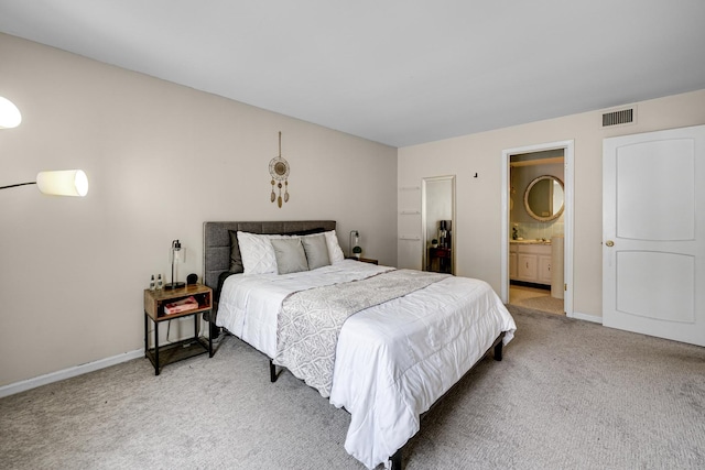 9802 S Karlov Ave Unit A, Oak Lawn, IL 60453 - bedroom with light carpet, baseboards, and ensuite bathroom