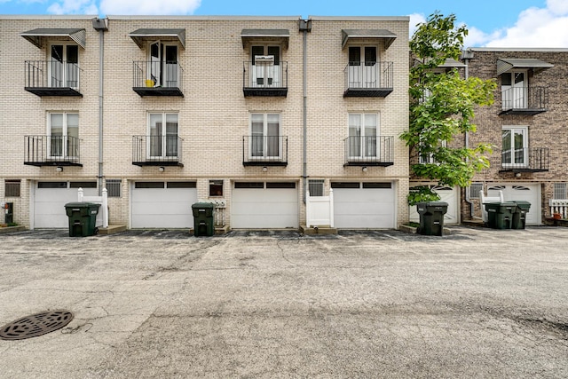 9802 S Karlov Ave Unit A, Oak Lawn, IL 60453 - view of apartment building / complex featuring a garage and driveway