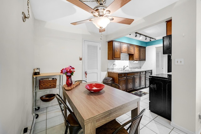 9802 S Karlov Ave Unit A, Oak Lawn, IL 60453 - kitchen featuring a ceiling fan, light tile patterned flooring, rail lighting, light countertops, and baseboards