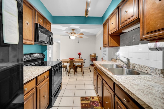 9802 S Karlov Ave Unit A, Oak Lawn, IL 60453 - kitchen with black appliances, a sink, tasteful backsplash, ceiling fan, and light countertops