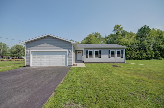 382 W 3rd St, Braidwood, IL 60408 - ranch-style house featuring asphalt driveway, an attached garage, and a front lawn