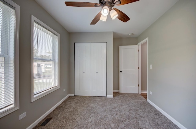 382 W 3rd St, Braidwood, IL 60408 - unfurnished bedroom featuring carpet flooring, a closet, and a ceiling fan
