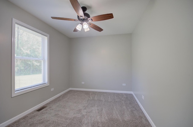 382 W 3rd St, Braidwood, IL 60408 - empty room featuring healthy amount of natural light, carpet, and ceiling fan