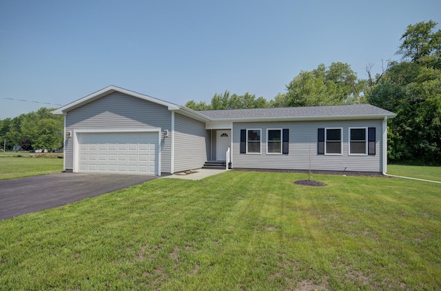 382 W 3rd St, Braidwood, IL 60408 - single story home with an attached garage, asphalt driveway, and a front yard