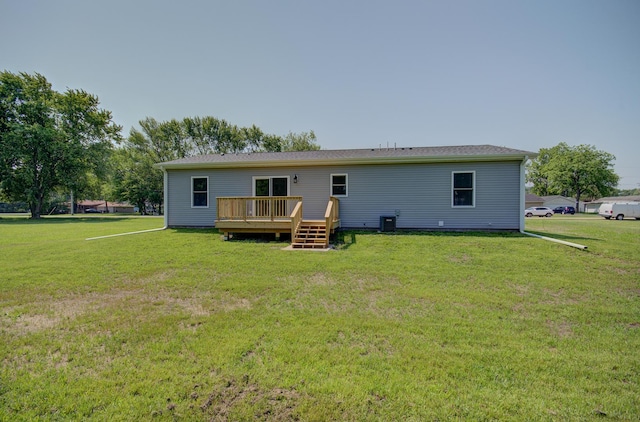 382 W 3rd St, Braidwood, IL 60408 - back of property with a wooden deck and a lawn