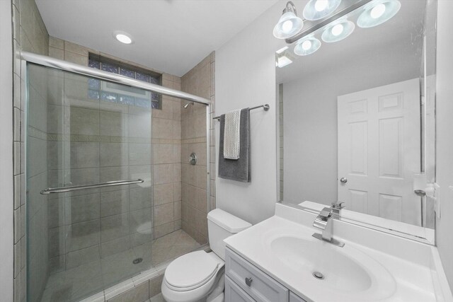 2515 W Harrison St Unit 1, Chicago, IL 60612 - bathroom with toilet, vanity, and a stall shower