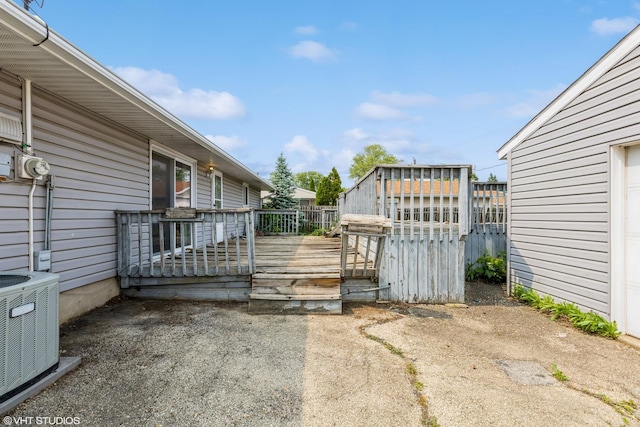 703 Hudson Ave, Romeoville, IL 60446 - gate featuring a wooden deck and cooling unit