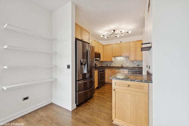720 W Randolph St Unit 707, Chicago, IL 60661 - kitchen featuring light brown cabinetry, stainless steel appliances, wood finished floors, dark countertops, and decorative backsplash