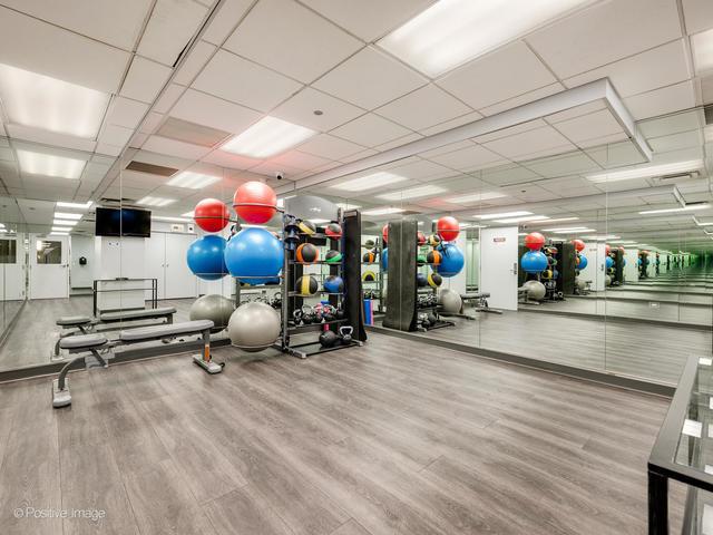 720 W Randolph St Unit 707, Chicago, IL 60661 - gym featuring wood finished floors