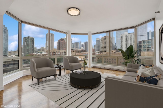720 W Randolph St Unit 707, Chicago, IL 60661 - sunroom with a view of skyline, wood finished floors, and a wall of windows