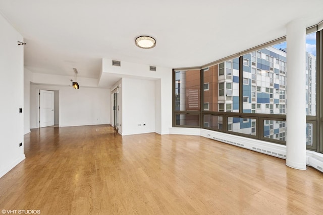 720 W Randolph St Unit 707, Chicago, IL 60661 - unfurnished living room featuring wood finished floors and baseboards