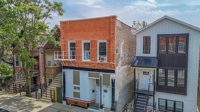 2653 W 21st St, Chicago, IL 60608 - view of front of property with a gate, stairway, and a standing seam roof