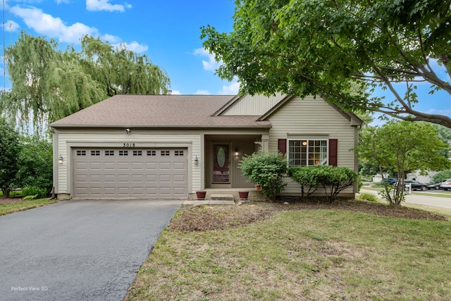 3018 Coastal Dr, Aurora, IL 60503 - ranch-style home with asphalt driveway, an attached garage, a front yard, and roof with shingles