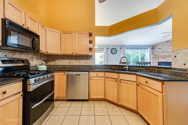 3018 Coastal Dr, Aurora, IL 60503 - kitchen with appliances with stainless steel finishes, light brown cabinetry, backsplash, light tile patterned flooring, and high vaulted ceiling