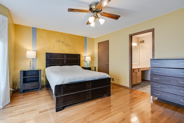 3018 Coastal Dr, Aurora, IL 60503 - bedroom with light wood-type flooring, connected bathroom, and ceiling fan